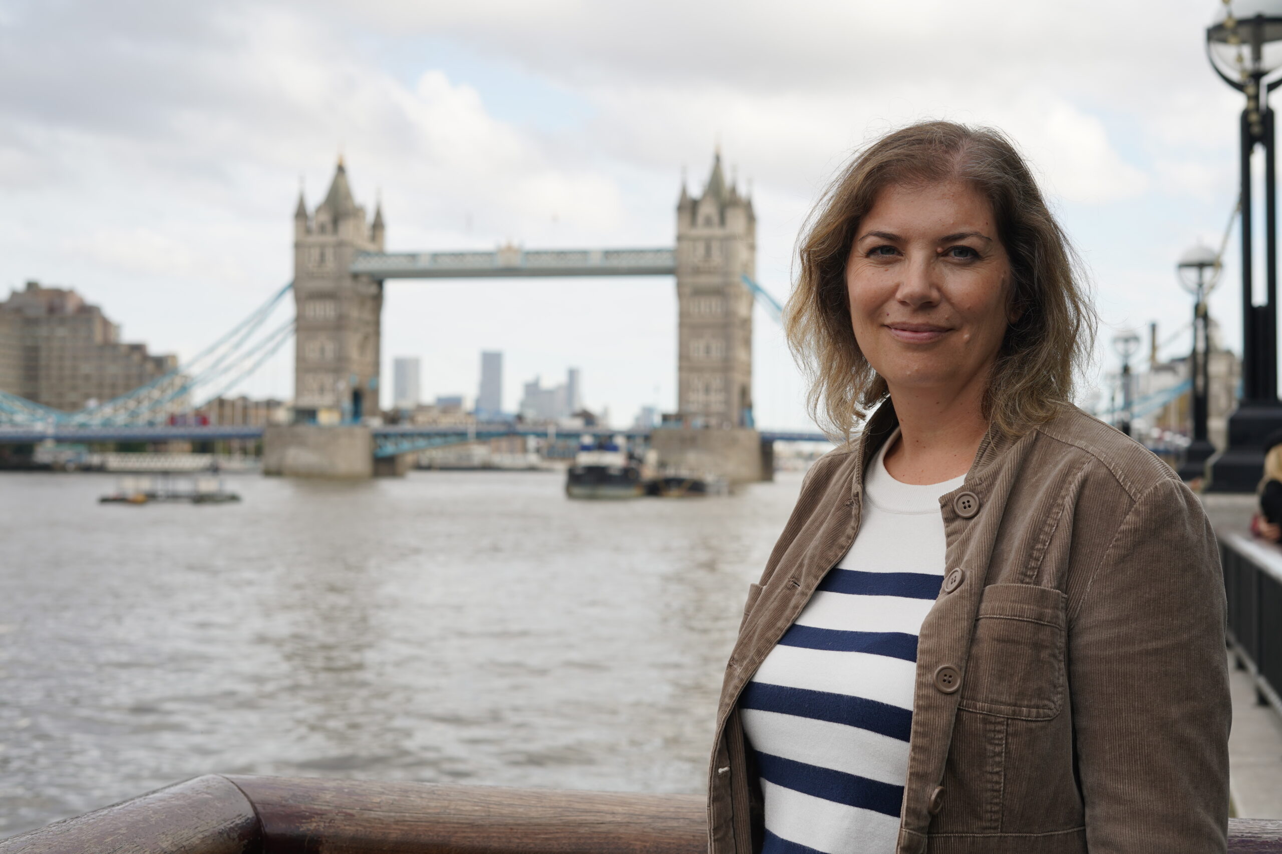 The website creator, Annwen Wheway standing in front of Tower Bridge