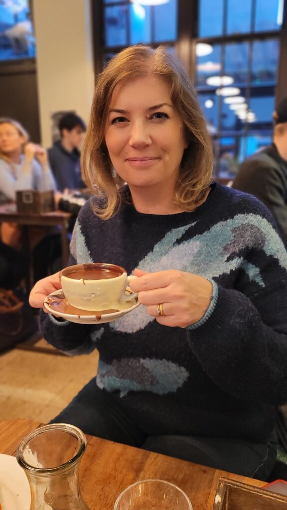 Sitting drinking a hot chocolate in Italian Bear Cafe