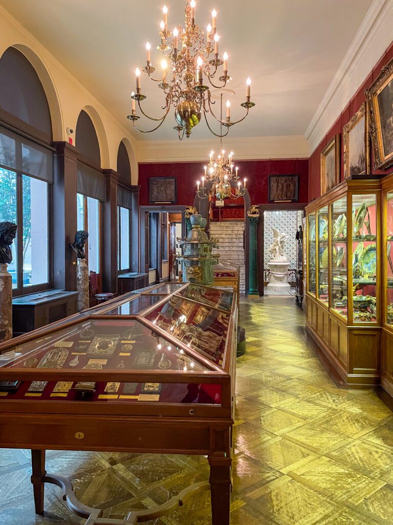 Glass cabinets filled with artefacts at The Wallace Collection