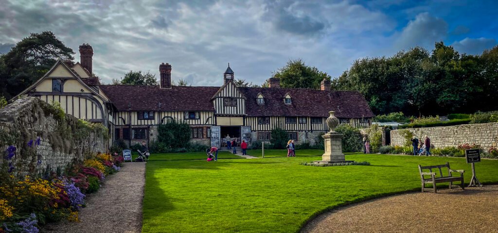 Old barn at Ightham Mote with a small green in front