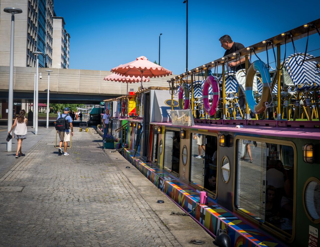 Canal boats converted into restaurants outside Paddington Station