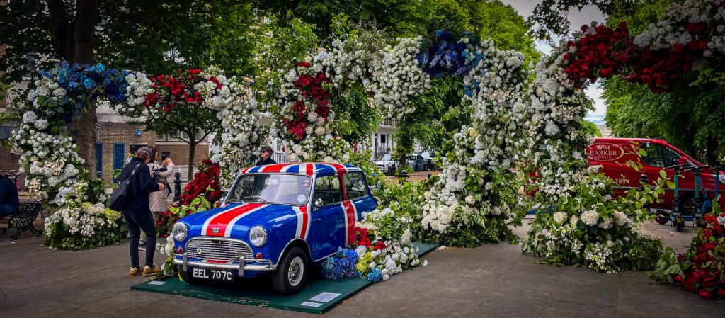 Floral display with a union jack mini cooper