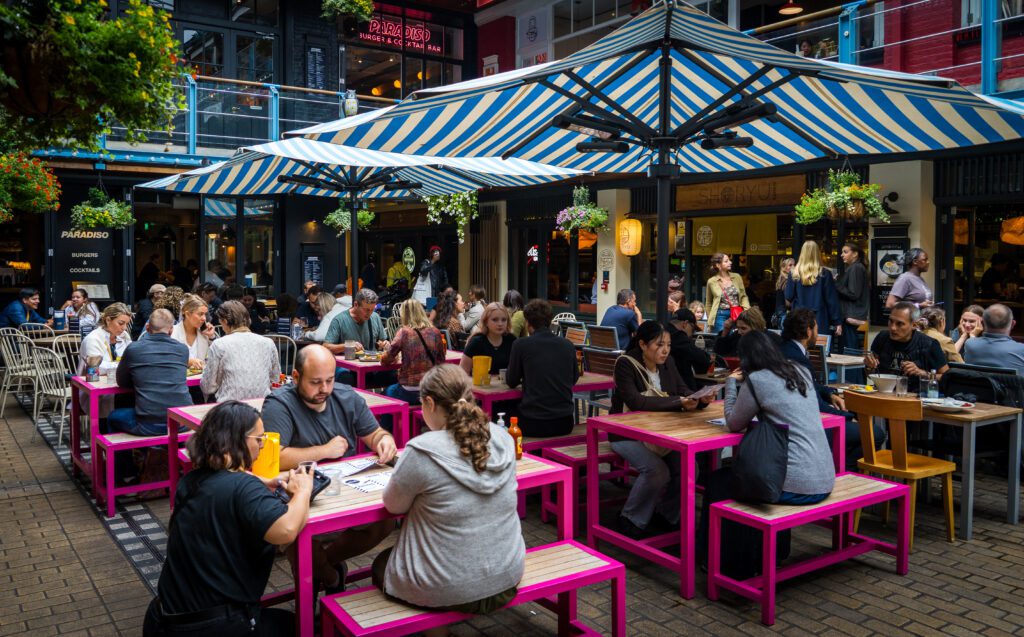 Kingly Food court with seating in the middle and shops all around