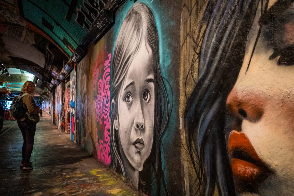 Pictures of faces as street art at the Leake Street Grafitti tunnel