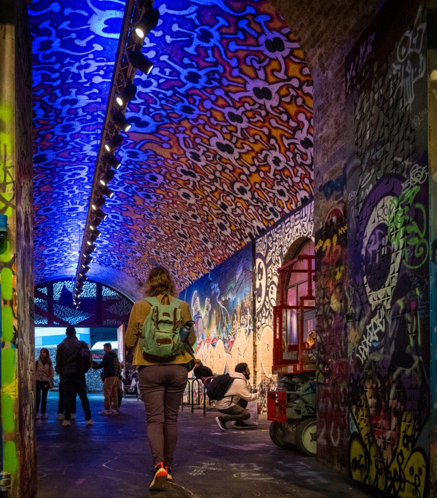 Side tunnel covered with graffiti at Leake Street graffiti tunnel