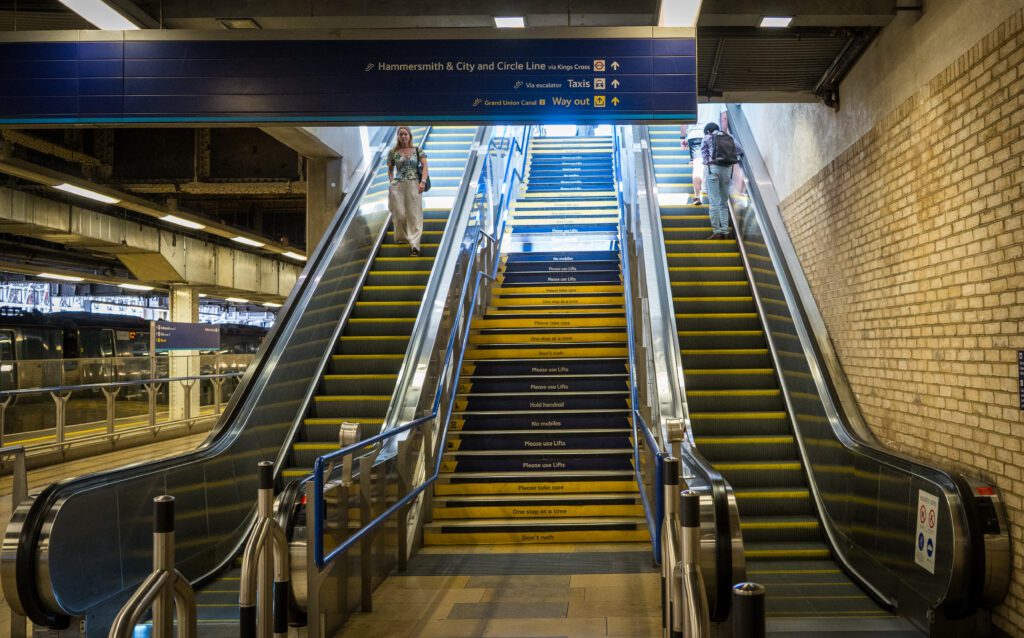 Escalators to the tube and canal exit at Paddington Station