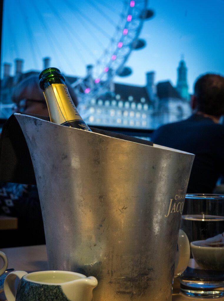 Champagne in a bucket on the afternoon tea cruise in front of the London Eye
