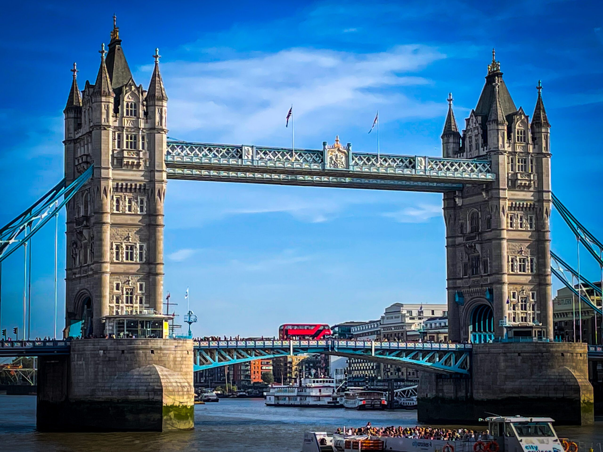 Tower Bridge with a red London bus on the bridge