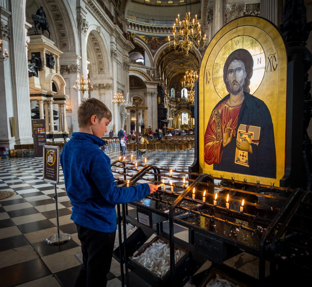 Lighting a candle at St Pauls Cathedral