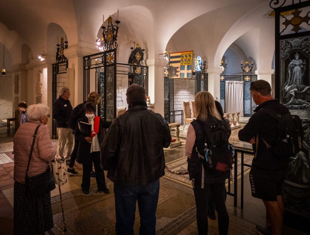 Tour Guide leading a tour of the Crypt