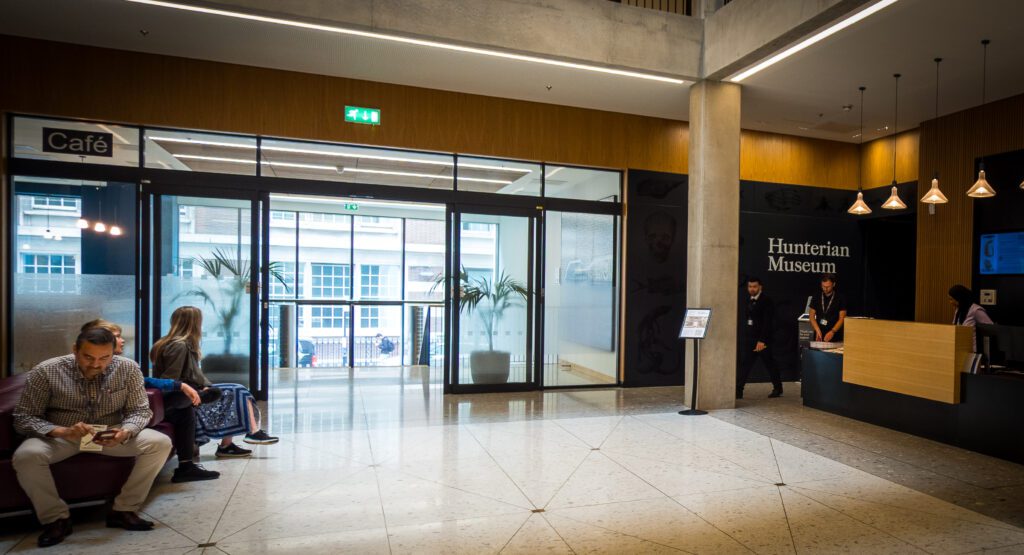 A lobby with desk and entrance to the Hunterian Museum