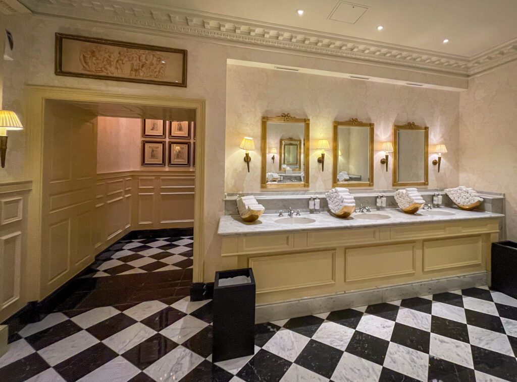 Ladies bathroom at The Savoy showing three sinks with handtowels and hand soap
