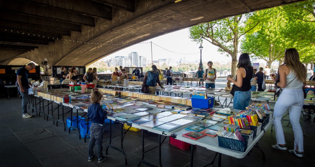 Secondhand books for sale under a railway arch on the Southbank