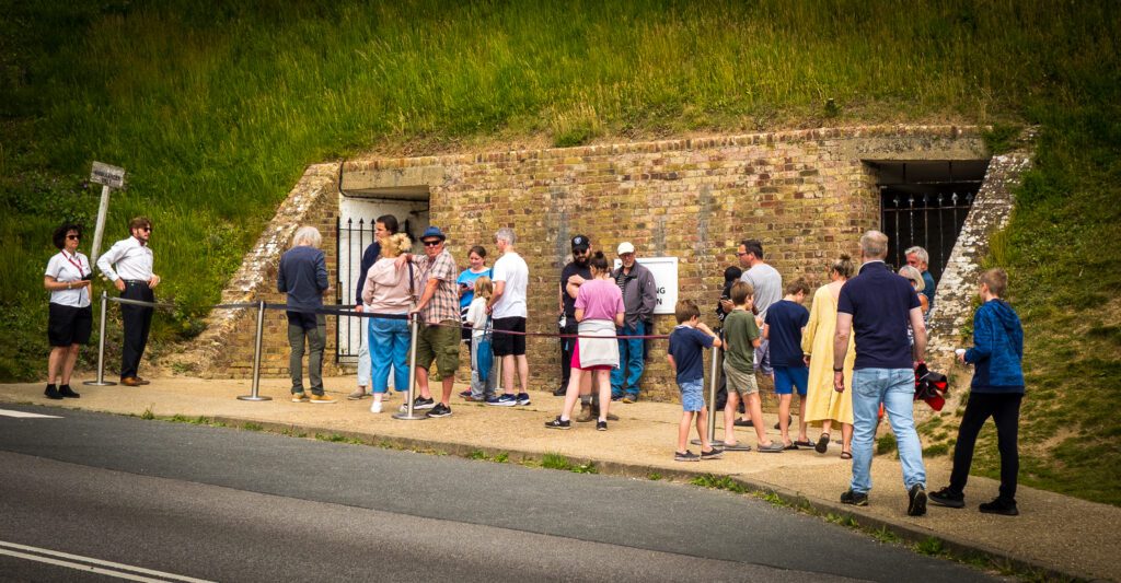 People queueing outside one of the world war two tunnels at Dover castle