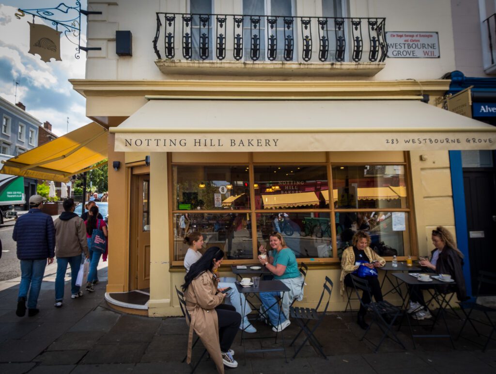 Notting Hill Bakery shop front with a couple of bistro tables and chairs outside