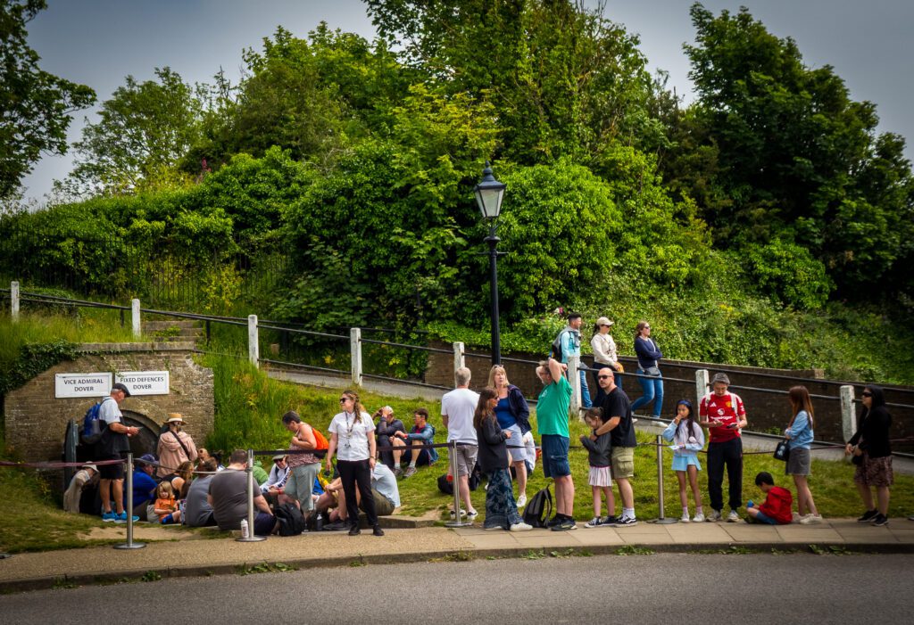 People queueing outside a tunnel used during World War II