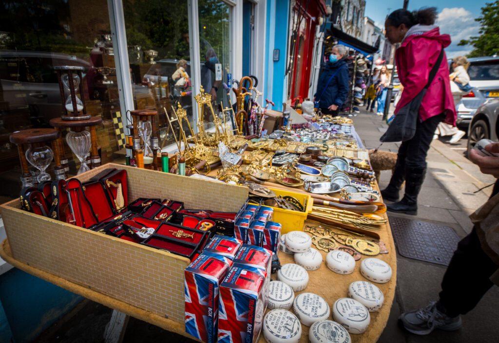 Souvenirs and vintage finds on a table outside a shop