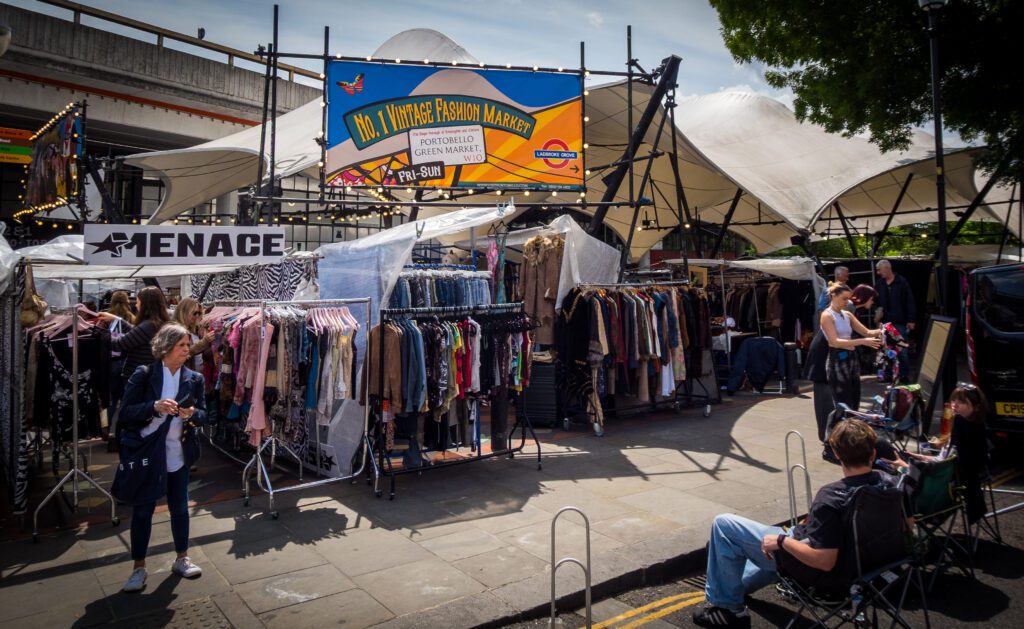 Vintage clothing on rails at the Portobello Road vintage fashion market