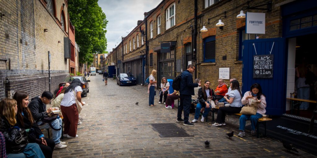 Bench seating outside Fortitude Bakehouse on the cobbled road