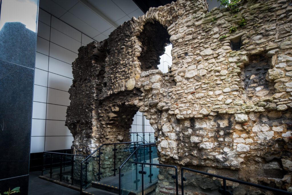 A section of the Roman Wall with a walkway through the arch doorway