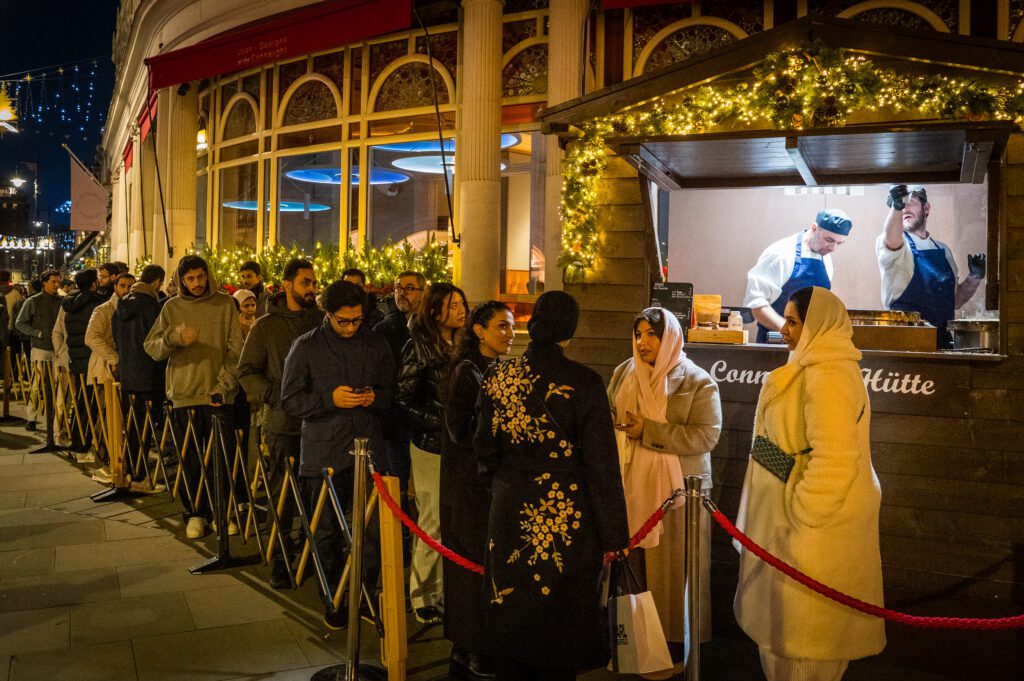 People queueing up outside the crepe hut outside The Connaught