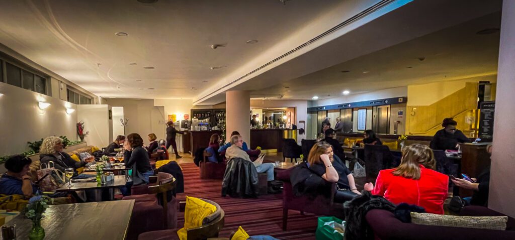 People sat at tables at the Waterstones Piccadilly Bar