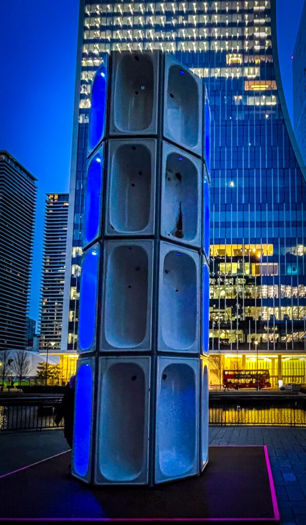 A tower of bath tubs stacked on top of each other as part of a light show