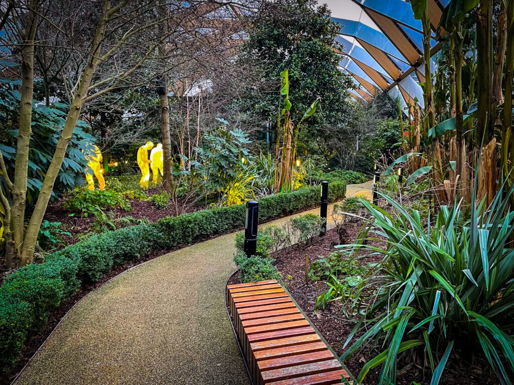Path through the roof top garden at Canary Wharf with some illuminated figures as part of the Winter Lights Festival